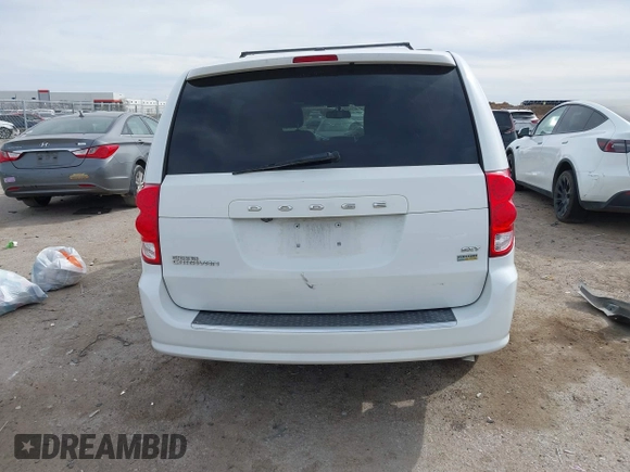2018 Dodge Grand Caravan SXT with VIN 2C4RDGCG2JR283490, listed as a IAAI auction lot 41796929 with 157,836 mi miles and . Bid and sale history available at DreamBid. Image 16.