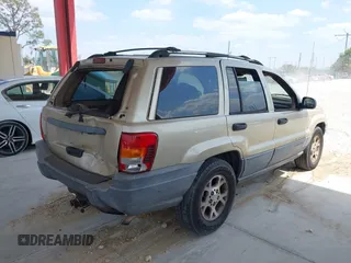 2001 Jeep Grand Cherokee Laredo with VIN 1J4GX48S81C589400, listed as a IAAI auction lot 42091559 with 219,698 mi miles and . Bid and sale history available at DreamBid. Image 4.
