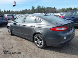 2015 Ford Fusion Energi Titanium with VIN 3FA6P0SU0FR200963, listed as a IAAI auction lot 41897182 with 104,100 mi miles. Bid and sale history available at carsss.com. Image 3.