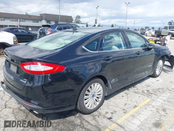 2015 Ford Fusion SE Hybrid with VIN 3FA6P0LU7FR199065, listed as a IAAI auction lot 41944181 with 197,020 mi miles. Bid and sale history available at carsss.com. Image 4.