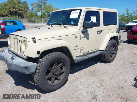 2011 Jeep Wrangler Sahara with VIN 1J4AA5D13BL562732, listed as a IAAI auction lot 41838520 with 148,359 mi miles and . Bid and sale history available at DreamBid. Image 2.
