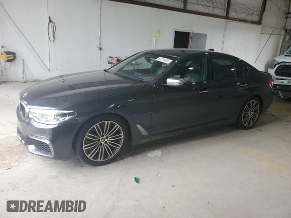 2018 BMW 5 Series M550i xDrive with VIN WBAJB9C58JB035267, listed as a Copart auction lot 64616605 with 125,365 mi miles and Clean title. Bid and sale history available at DreamBid. Image 1.