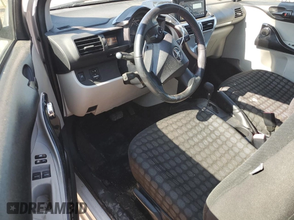 2012 Scion iQ with VIN JTNJJXB05CJ010539, listed as a Copart auction lot 56489245 with 114,623 mi miles and Salvage title. Bid and sale history available at DreamBid. Image 8.