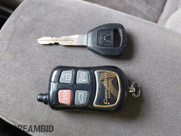 1999 Honda Accord EX z VIN 1HGCG5658XA034945, wystawiony jako IAAI lot #41687146 z przebiegiem 234 497 mil mil oraz . Historia ofert i sprzedaży dostępna na DreamBid. Obrazek 11.