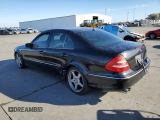 2004 Mercedes-Benz E-Class 5.0L with VIN WDBUF70J64A585084, listed as a Copart auction lot 80297124 with 233,638 mi miles and Salvage Title. Bid and sale history available at carsss.com. Image 2.