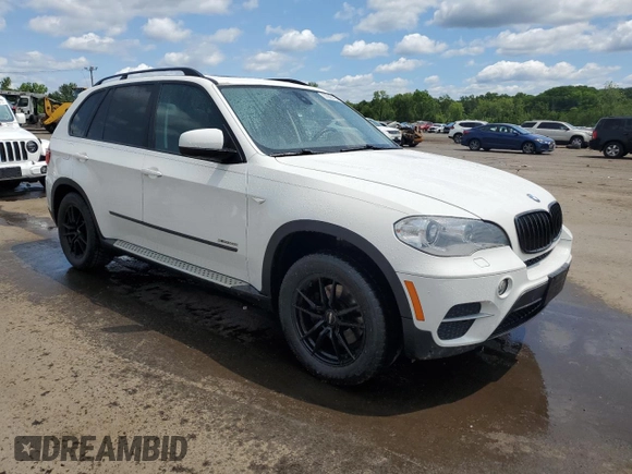 2012 BMW X5 35i with VIN 5UXZV4C54CL763857, listed as a Copart auction lot 57943195 with 143,522 mi miles and Salvage title. Bid and sale history available at DreamBid. Image 4.
