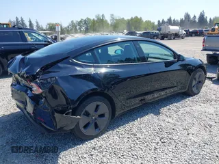 2022 Tesla Model 3 Long Range with VIN 5YJ3E1EB7NF241996, listed as a IAAI auction lot 42115915 with 23,433 mi miles and . Bid and sale history available at DreamBid. Image 4.