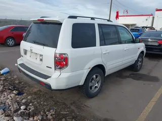 2006 Honda Pilot EX-L with VIN 2HKYF18576H517590, listed as a IAAI auction lot 41802601 with 233,833 mi miles. Bid and sale history available at carsss.com. Image 4.