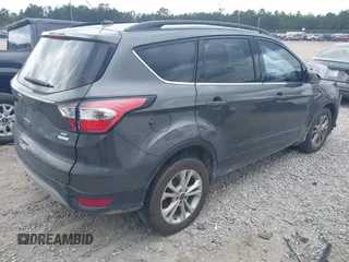 2017 Ford Escape SE z VIN 1FMCU0GD8HUE00754, wystawiony jako IAAI lot #42127911 z przebiegiem 169 487 mil mil oraz . Historia ofert i sprzedaży dostępna na DreamBid. Obrazek 4.