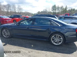 2016 Audi A8 L 4.0T Sport with VIN WAU43AFD1GN022253, listed as a IAAI auction lot 41858053 with 219,517 mi miles. Bid and sale history available at carsss.com. Image 14.