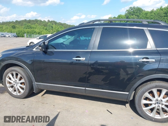 2015 Mazda CX-9 Grand Touring with VIN JM3TB2DA4F0464186, listed as a IAAI auction lot 42227595 with 124,526 mi miles and . Bid and sale history available at DreamBid. Image 14.