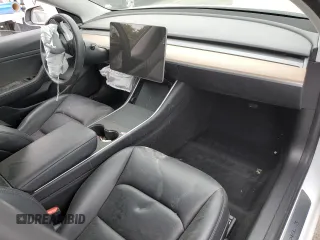 2020 Tesla Model 3 Standard Range Plus with VIN 5YJ3E1EA5LF747010, listed as a Copart auction lot 50937975 with Not Provided miles and Salvage Title. Bid and sale history available at DreamBid. Image 8.