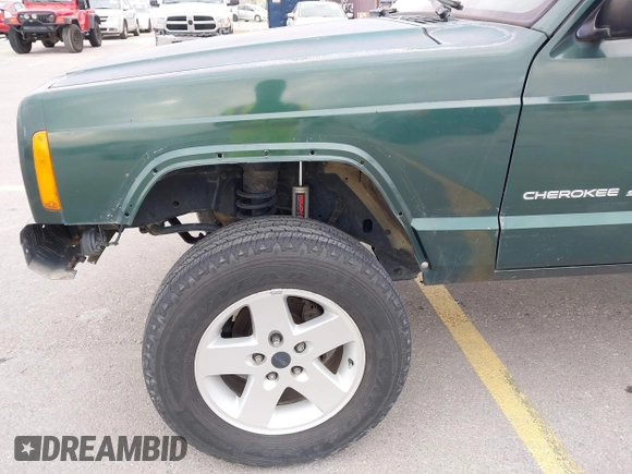 1999 Jeep Cherokee Sport z VIN 1J4FT68S1XL667138, wystawiony jako IAAI lot #42651020 z przebiegiem 200 324 mil mil oraz . Historia ofert i sprzedaży dostępna na DreamBid. Obrazek 6.