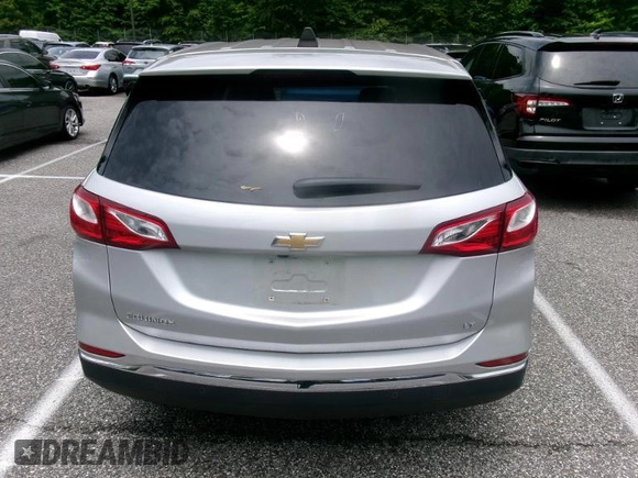 2020 Chevrolet Equinox LT with VIN 2GNAXJEV7L6231166, listed as a IAAI auction lot 42572055 with 24,491 mi miles and . Bid and sale history available at DreamBid. Image 4.