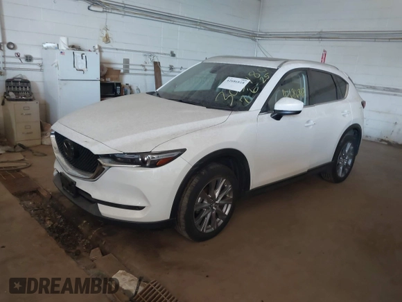 2019 Mazda CX-5 Grand Touring with VIN JM3KFBDM5K0520852, listed as a IAAI auction lot 42686818 with 36,800 mi miles and . Bid and sale history available at DreamBid. Image 17.