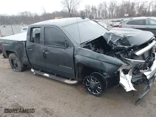2018 Chevrolet Silverado 1500 LT with VIN 1GCVKREC4JZ141125, listed as a IAAI auction lot 41474345 with 198,197 mi miles. Bid and sale history available at carsss.com. Image 1.