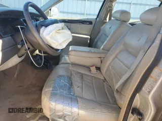 1999 Lincoln Town Car Signature z VIN 1LNHM82W3XY689627, wystawiony jako Copart lot #86387904 z przebiegiem Nie podano mil oraz Szkody całkowita. Historia ofert i sprzedaży dostępna na DreamBid. Obrazek 7.