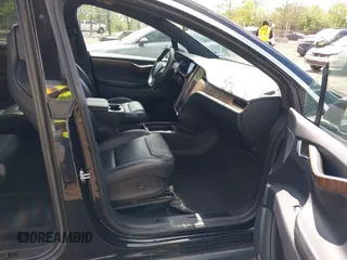 2019 Tesla Model X 75D with VIN 5YJXCBE21KF180203, listed as a IAAI auction lot 42190255 with 114,294 mi miles and . Bid and sale history available at carsss.com. Image 5.