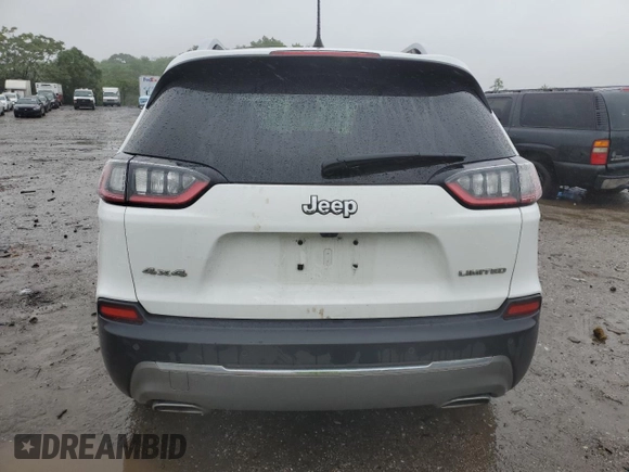 2019 Jeep Cherokee Limited z VIN 1C4PJMDXXKD409564, wystawiony jako Copart lot #60893225 z przebiegiem 128 674 mil mil oraz Szkoda całkowita • Salvage title. Historia ofert i sprzedaży dostępna na DreamBid. Obrazek 6.