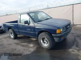 1993 Isuzu Pickup S z VIN 4S1CL11L7P4207354, wystawiony jako IAAI lot #41237021 z przebiegiem 192 502 mil mil oraz . Historia ofert i sprzedaży dostępna na DreamBid. Obrazek 1.