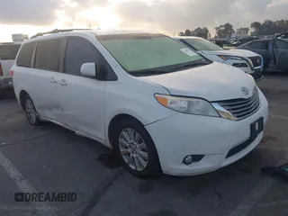 2015 Toyota Sienna Ltd with VIN 5TDDK3DC8FS100841, listed as a IAAI auction lot 41539557 with 219,816 mi miles. Bid and sale history available at carsss.com. Image 1.