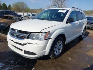 2014 Dodge Journey SE with VIN 3C4PDCAB0ET293641, listed as a IAAI auction lot 42001844 with 138,740 mi miles. Bid and sale history available at carsss.com. Image 18.