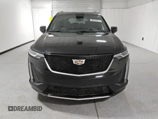 2023 Cadillac XT6 AWD Sport z VIN 1GYKPGRS3PZ133580, wystawiony jako Copart lot #44825095 z przebiegiem 12 168 mil mil oraz Czysty tytuł • Clean title. Historia ofert i sprzedaży dostępna na DreamBid. Obrazek 5.