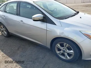 2014 Ford Focus SE with VIN 1FADP3F27EL396785, listed as a IAAI auction lot 42113377 with 147,851 mi miles. Bid and sale history available at carsss.com. Image 6.