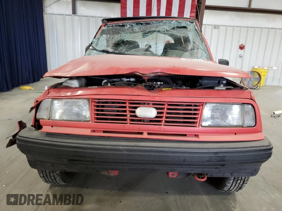 1994 Geo Tracker z VIN 2CNBE18U3R6952403, wystawiony jako Copart lot #79038524 z przebiegiem 271 461 mil mil oraz Szkody całkowita. Historia ofert i sprzedaży dostępna na DreamBid. Obrazek 5.