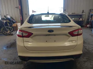 2016 Ford Fusion Titanium z VIN 3FA6P0D93GR116355, wystawiony jako IAAI lot #42158991 z przebiegiem 59 602 mil mil oraz . Historia ofert i sprzedaży dostępna na DreamBid. Obrazek 16.