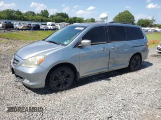 2007 Honda Odyssey Touring with VIN 5FNRL38887B117251, listed as a Copart auction lot 61805245 with 163,964 mi miles and Salvage title. Bid and sale history available at DreamBid. Image 1.