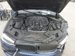 2018 BMW 5 Series M550i xDrive with VIN WBAJB9C56JG463891, listed as a IAAI auction lot 41731556 with 104,860 mi miles. Bid and sale history available at carsss.com. Image 10.