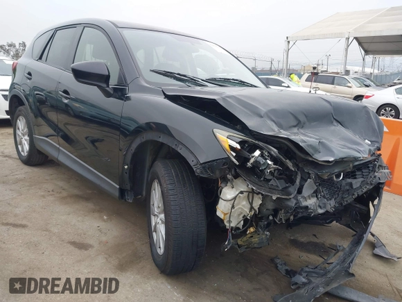 2014 Mazda CX-5 Touring z VIN JM3KE2CY3E0355332, wystawiony jako IAAI lot #42096306 z przebiegiem 108 198 mil mil oraz . Historia ofert i sprzedaży dostępna na DreamBid. Obrazek 1.