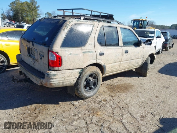 2001 Isuzu Rodeo S z VIN 4S2DM58W214322178, wystawiony jako IAAI lot #41398609 z przebiegiem 180 017 mil mil oraz . Historia ofert i sprzedaży dostępna na DreamBid. Obrazek 4.