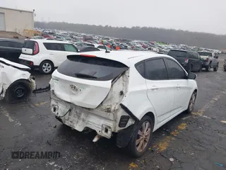 2014 Hyundai Accent SE with VIN KMHCU5AE8EU145629, listed as a IAAI auction lot 41497848 with 134,919 mi miles. Bid and sale history available at carsss.com. Image 4.
