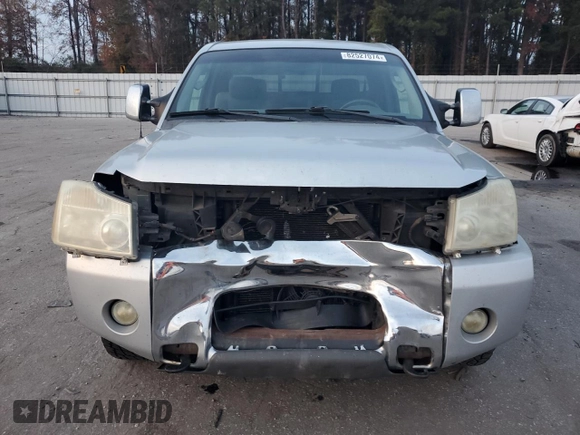 2005 Nissan Titan SE with VIN 1N6BA06B45N539629, listed as a Copart auction lot 82527074 with 154,255 mi miles and Salvage title. Bid and sale history available at DreamBid. Image 5.