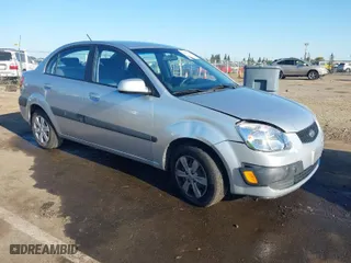 2009 Kia Rio SX with VIN KNADE223296523842, listed as a IAAI auction lot 42024905 with 98,613 mi miles. Bid and sale history available at carsss.com. Image 1.