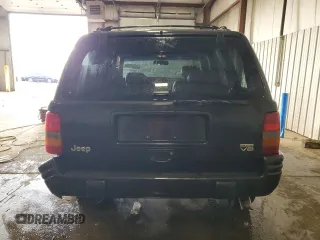 1998 Jeep Grand Cherokee Limited z VIN 1J4GZ88Z0WC276394, wystawiony jako Copart lot #46702355 z przebiegiem 144 232 mil mil oraz Szkoda całkowita • Salvage title. Historia ofert i sprzedaży dostępna na DreamBid. Obrazek 6.