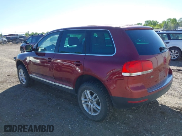 2004 Volkswagen Touareg z VIN WVGBC67L24D004600, wystawiony jako IAAI lot #42283582 z przebiegiem 192 135 mil mil oraz . Historia ofert i sprzedaży dostępna na DreamBid. Obrazek 3.