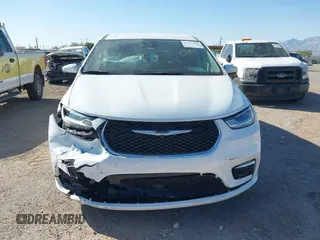 2023 Chrysler Pacifica Touring L with VIN 2C4RC1BG6PR531640, listed as a IAAI auction lot 42251680 with 31,638 mi miles and . Bid and sale history available at DreamBid. Image 12.