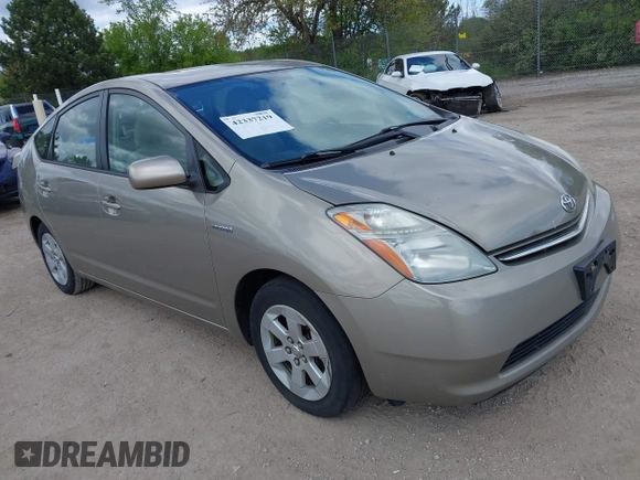 2007 Toyota Prius z VIN JTDKB20U573212497, wystawiony jako IAAI lot #42337219 z przebiegiem 198 984 mil mil oraz . Historia ofert i sprzedaży dostępna na DreamBid. Obrazek 1.