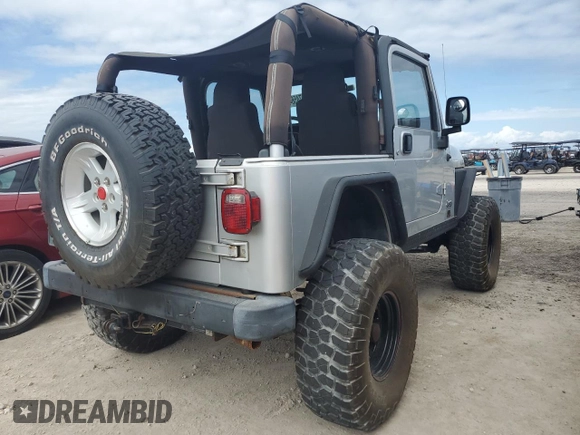 2003 Jeep Wrangler Rubicon z VIN 1J4FA69S53P340085, wystawiony jako Copart lot #74564574 z przebiegiem Nie podano mil oraz Szkoda całkowita • Salvage title. Historia ofert i sprzedaży dostępna na DreamBid. Obrazek 3.