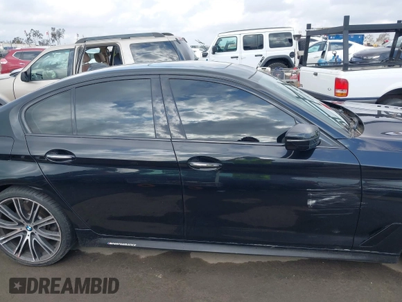 2018 BMW 5 Series 540i z VIN WBAJE5C5XJWA94252, wystawiony jako IAAI lot #42119366 z przebiegiem 53 762 mil mil oraz . Historia ofert i sprzedaży dostępna na DreamBid. Obrazek 13.