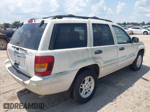 2004 Jeep Grand Cherokee Laredo with VIN 1J4GX48S94C222249, listed as a IAAI auction lot 42598242 with 196,745 mi miles and . Bid and sale history available at DreamBid. Image 4.