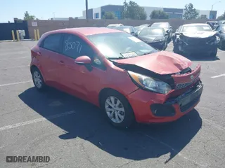 2014 Kia Rio SX with VIN KNADN5A35E6419973, listed as a IAAI auction lot 41885071 with 77,304 mi miles. Bid and sale history available at carsss.com. Image 1.