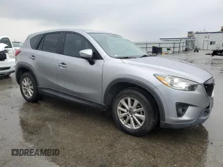 2015 Mazda CX-5 Touring with VIN JM3KE2CY4F0469096, listed as a Copart auction lot 48075105 with 131,788 mi miles and Salvage Title. Bid and sale history available at carsss.com. Image 4.