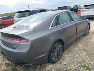 2014 Lincoln MKZ Hybrid with VIN 3LN6L2LU1ER814964, listed as a IAAI auction lot 40712613 with Not provided miles and . Bid and sale history available at DreamBid. Image 4.