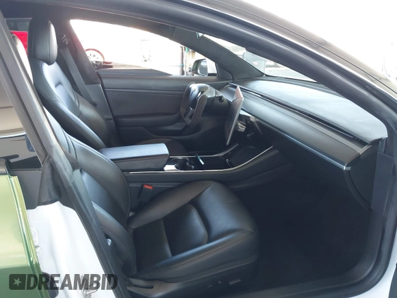 2020 Tesla Model 3 Standard Range Plus with VIN 5YJ3E1EA4LF799650, listed as a IAAI auction lot 41817538 with 54,835 mi miles. Bid and sale history available at carsss.com. Image 5.