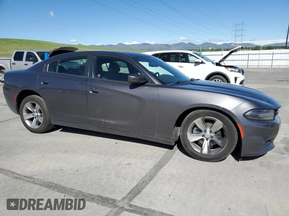 2015 Dodge Charger SXT with VIN 2C3CDXHG9FH856319, listed as a Copart auction lot 57251335 with 171,454 mi miles and Salvage title. Bid and sale history available at DreamBid. Image 4.