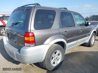 2006 Ford Escape Hybrid with VIN 1FMCU96H76KA56562, listed as a IAAI auction lot 42096713 with 148,963 mi miles. Bid and sale history available at carsss.com. Image 4.